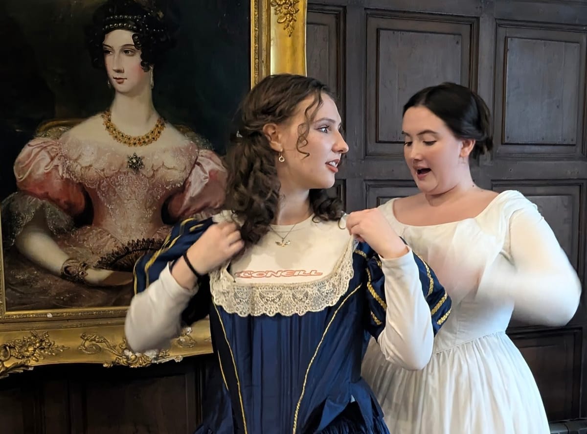 Two women in Victorian period costume